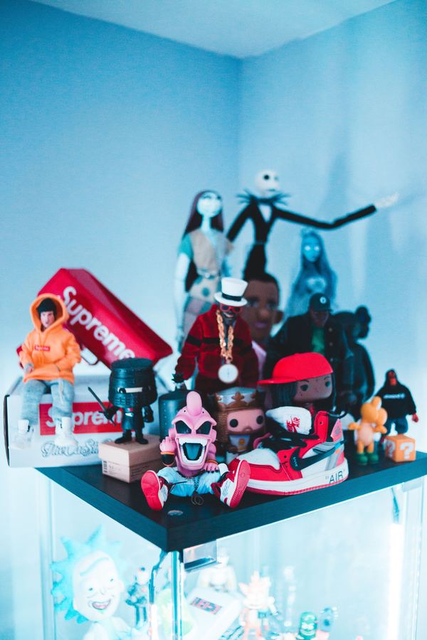 Shelf display of collectible figures and a sneaker box, including Funko Pops and vinyl toys — KDG Finds collectibles category, South Africa